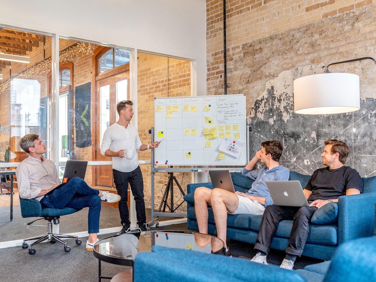 Instructor mapping AI earning workflow modules on a whiteboard